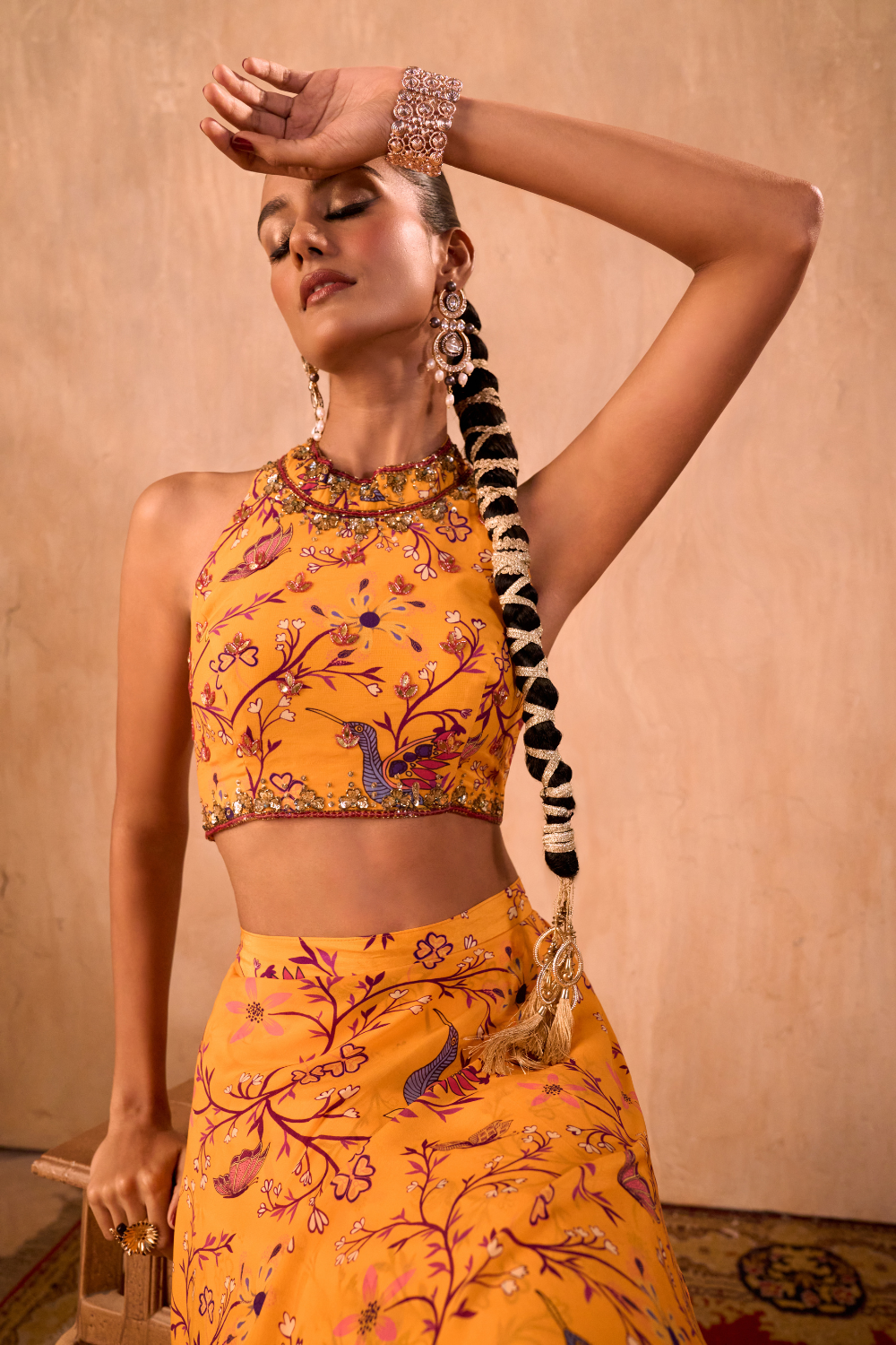 YELLOW PRINT EMBROIDERED HALTER CHOLI AND LAYERED LEHENGA SKIRT SET
