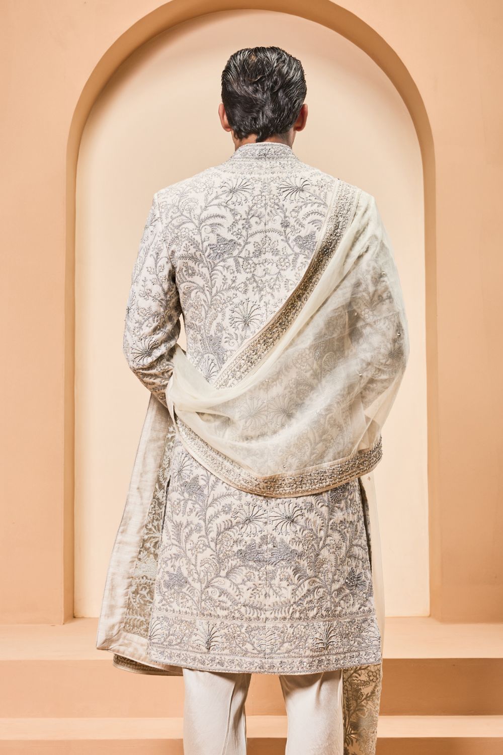 Ivory sherwani detailing with silver zari,pearl,sequins and thread work