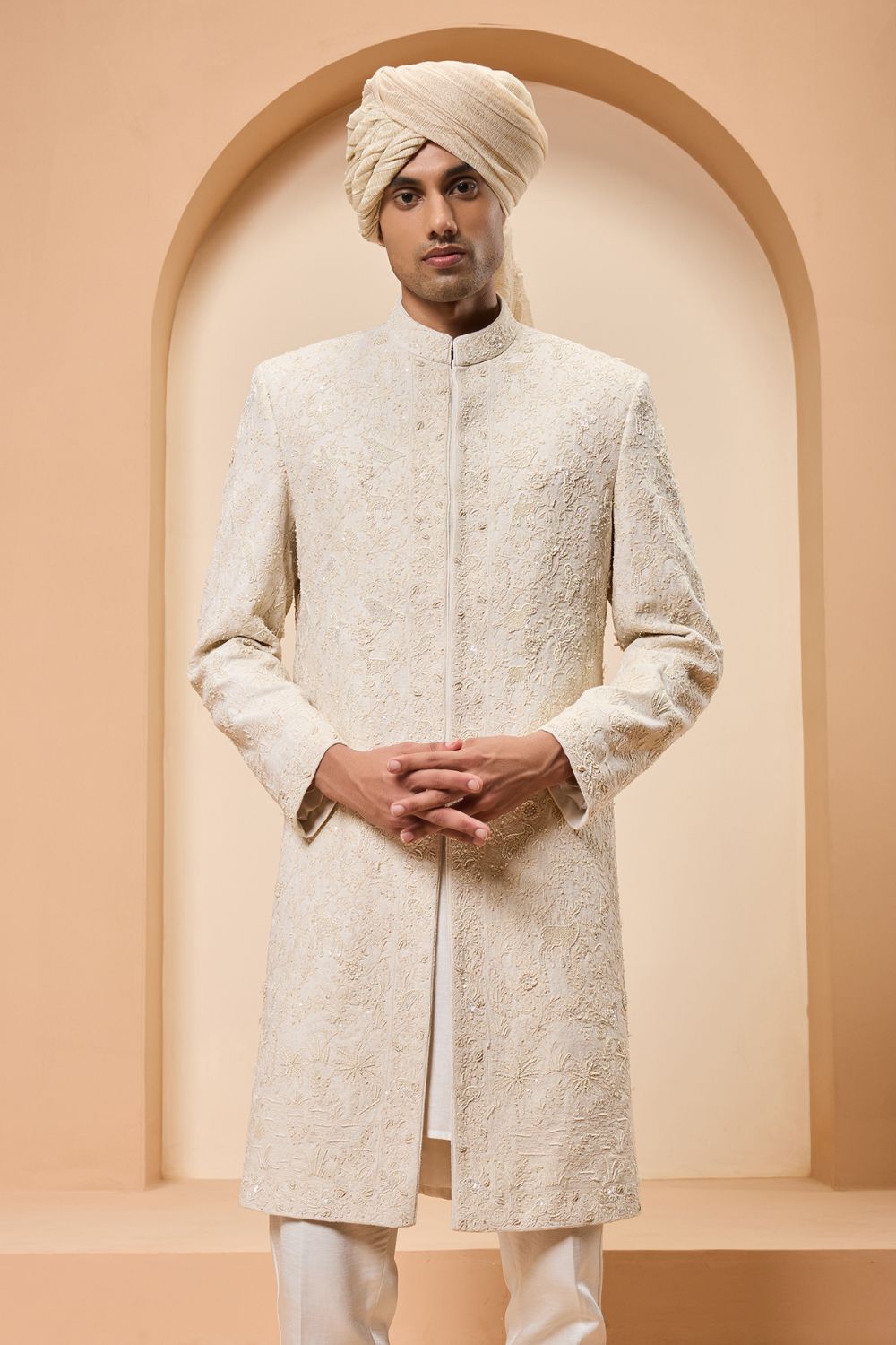 Ivory sherwani detailing with pearl,sequins and thread work