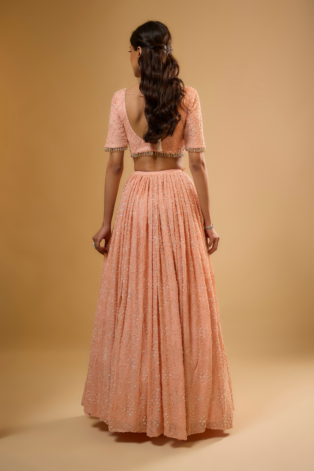 Peach sorbet georgette Lehenga set embroidered with sequins, glass beads & threadwork