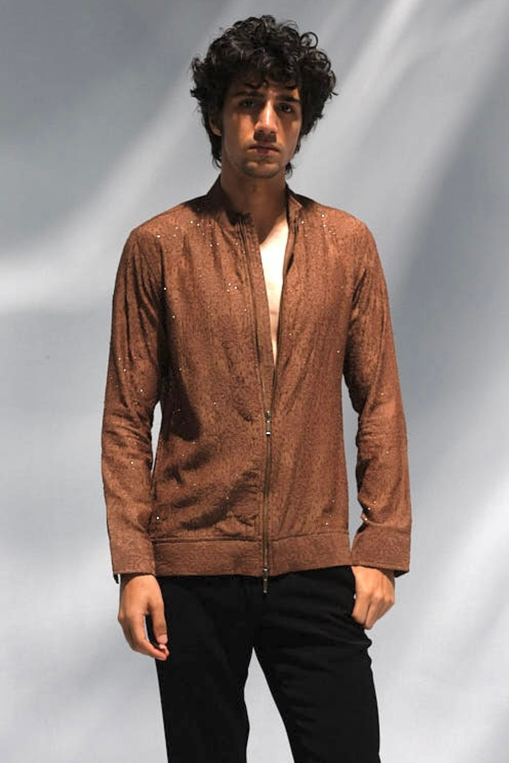 Brown cross stitch and bead work jacket .