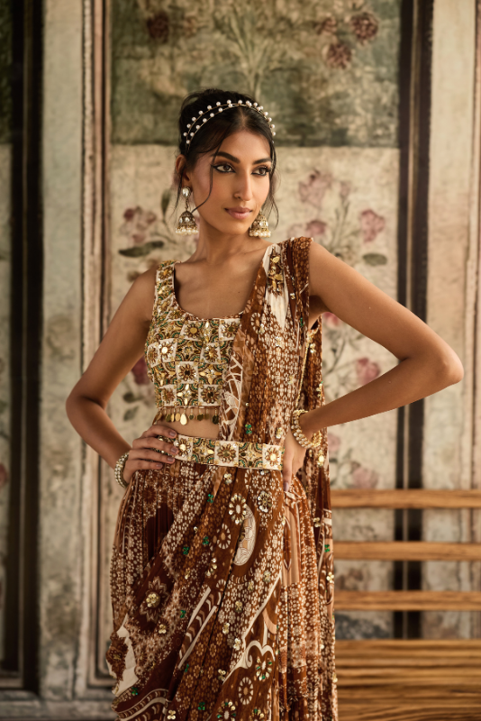 IVORY BUTTA PRINT AND HIGHLIGHTED SQUARE NECK BLOUSE WITH CARAMEL PRINT AND HIGHLIGHTED TIERED SKIRT SAREE SET