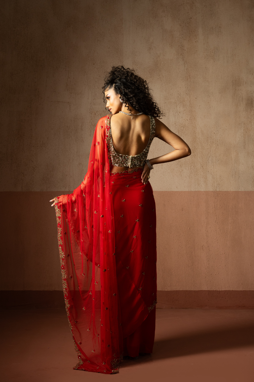 Predraped , red , hand embroidered net & georgette saree with golden blouse