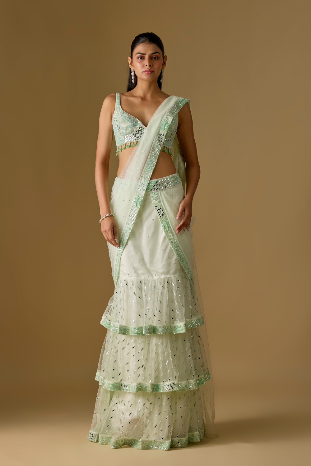 Aquaria- Mint designer pre draped saree in satin organza base with hand embroidery. It is paired with a tulle blouse.