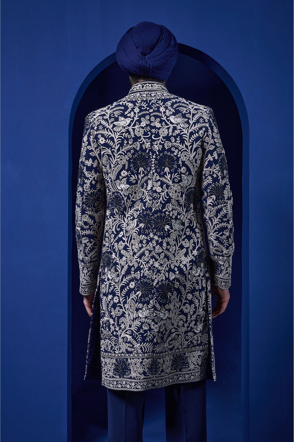 Navy blue Indo Western highlighted with sequins, pearls and thread work