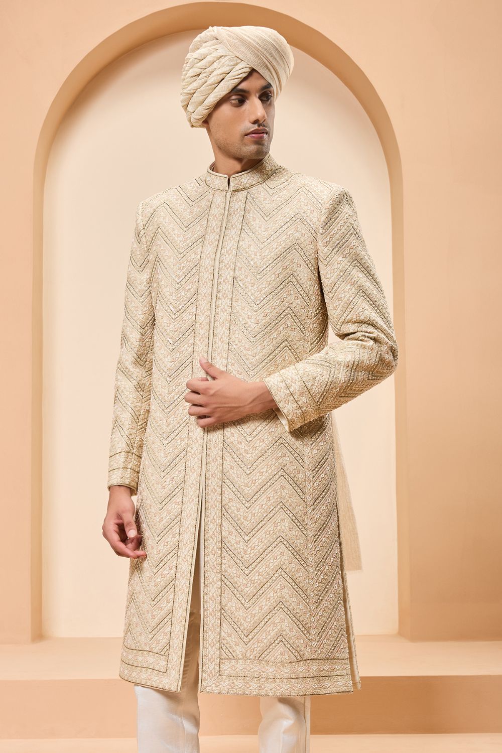 Ivory gold sherwani detailing with zardozi,pearl,sequins and thread work