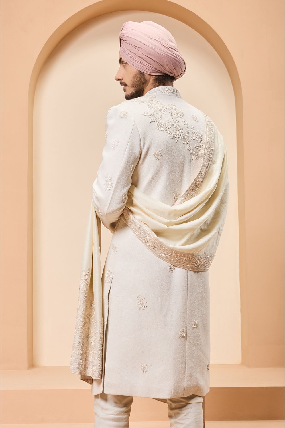 Ivory sherwani detailing with sequins and with thread work