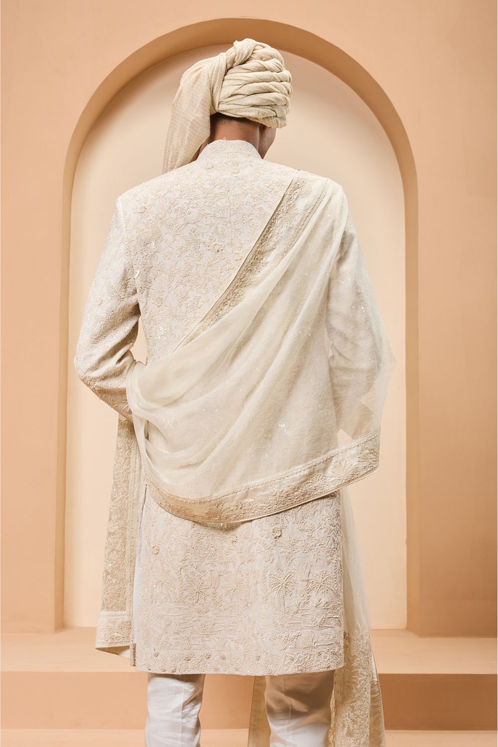 Ivory sherwani detailing with pearl,sequins and thread work
