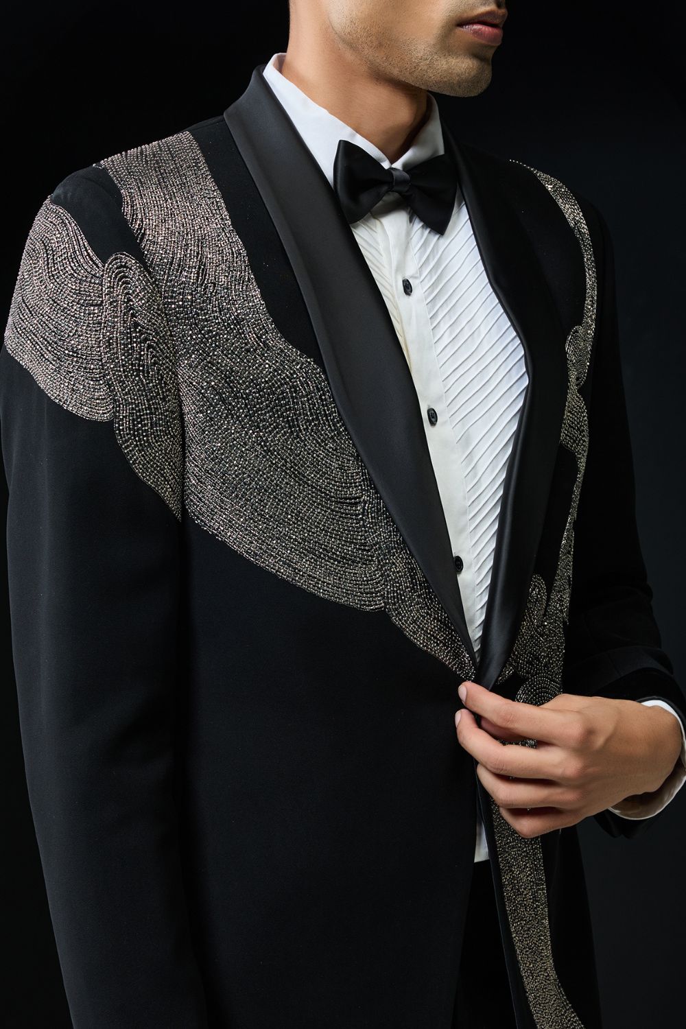 Black tuxedo highlighted with silver zari , cutdana and peals
