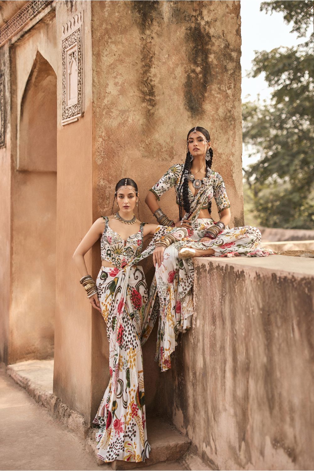 IVORY PRINT AND HIGHLIGHTED CORSET WITH DHOTI SKIRT SAREE SET