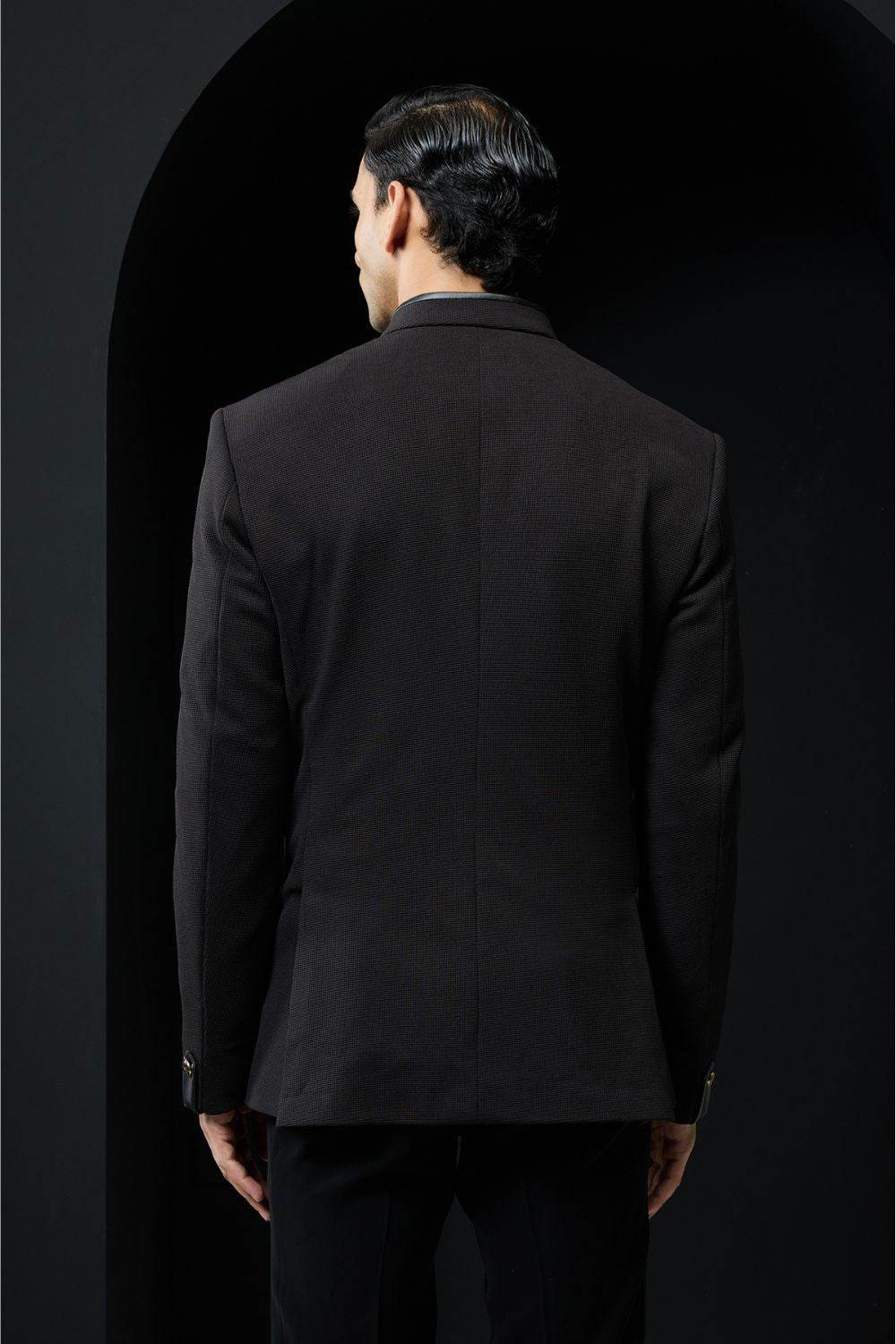 Black bandhgala with slant cut detailing with golden button and with satin taping