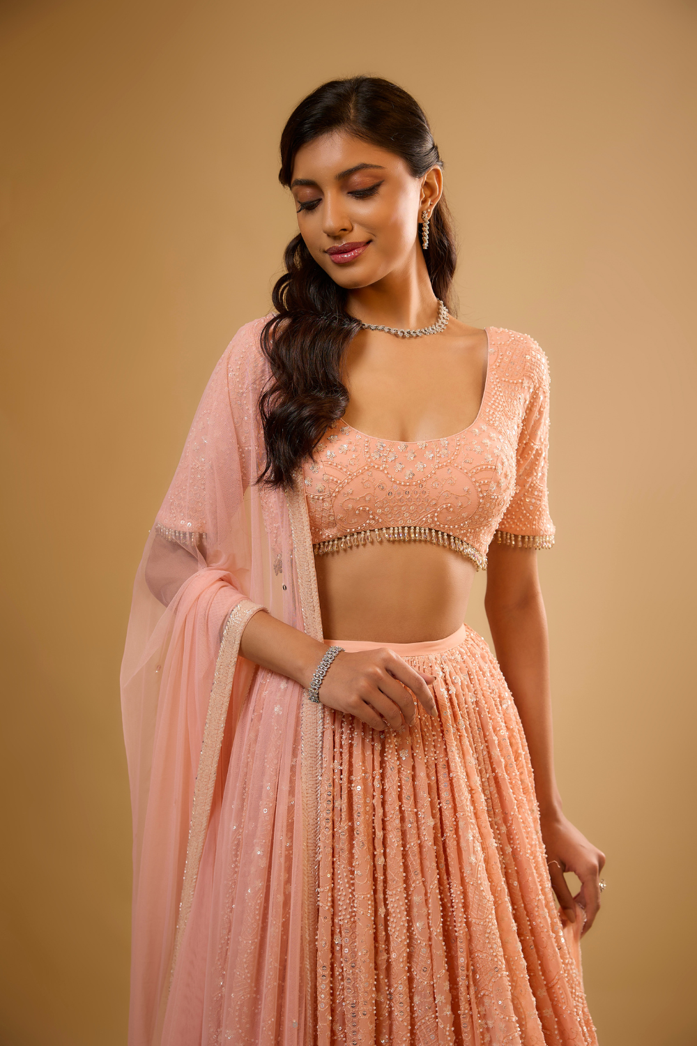Peach sorbet georgette Lehenga set embroidered with sequins, glass beads & threadwork