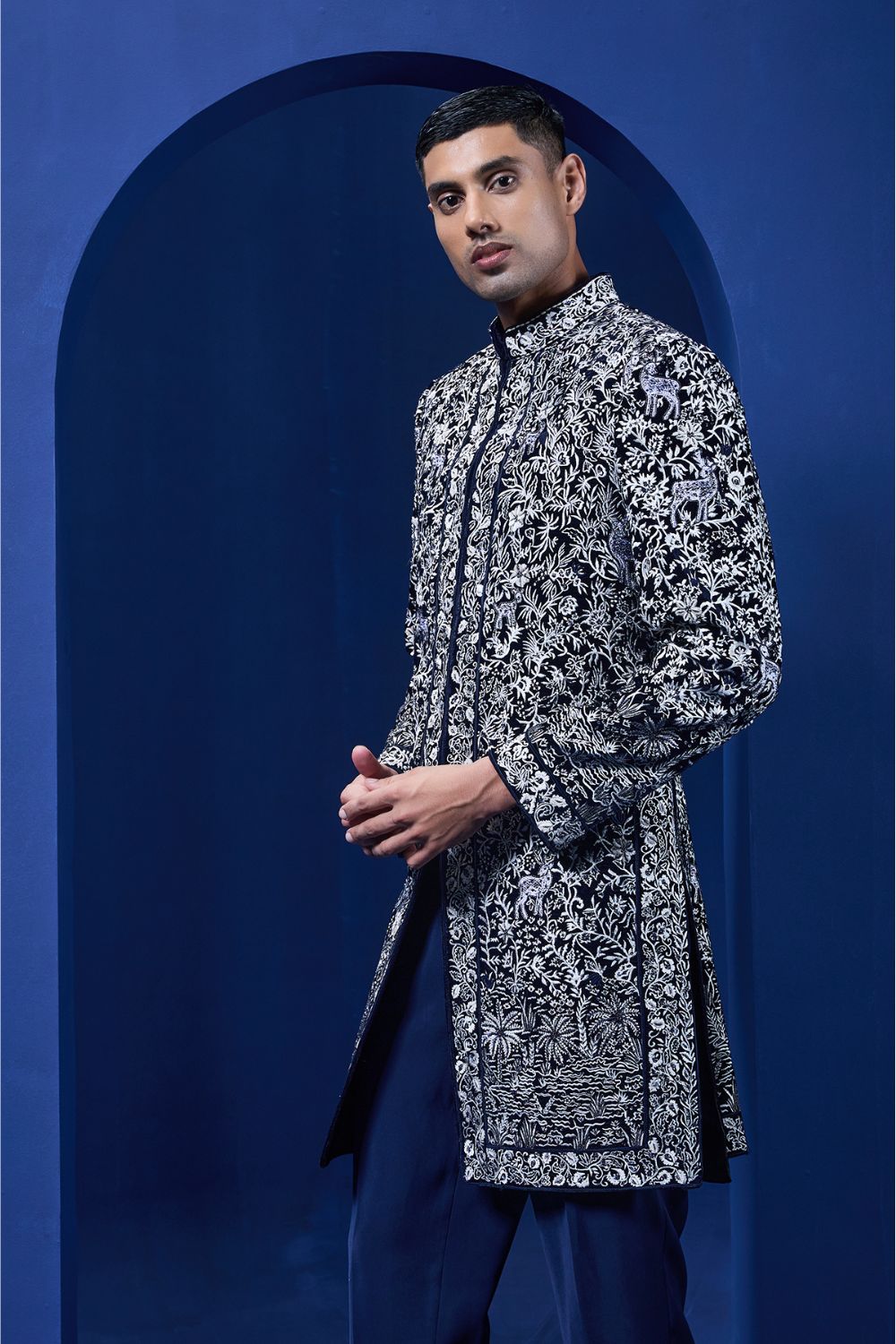 Navy blue Indo Western highlighted with sequins, pearls and thread work