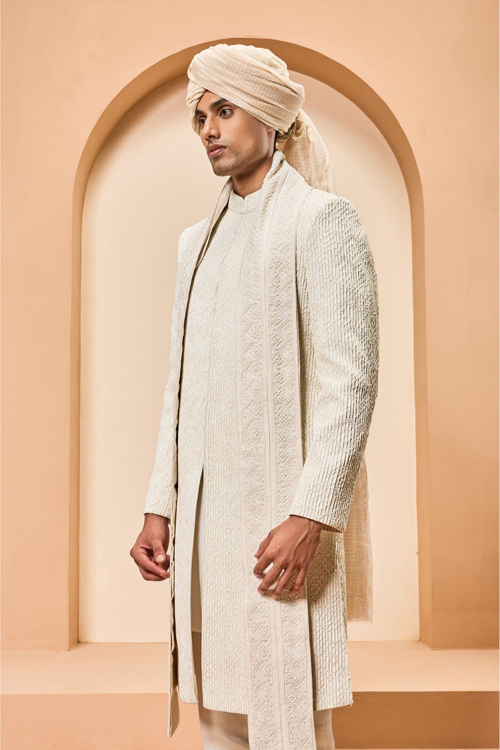 Ivory sherwani detailing with pearl,cutdana and pintex work