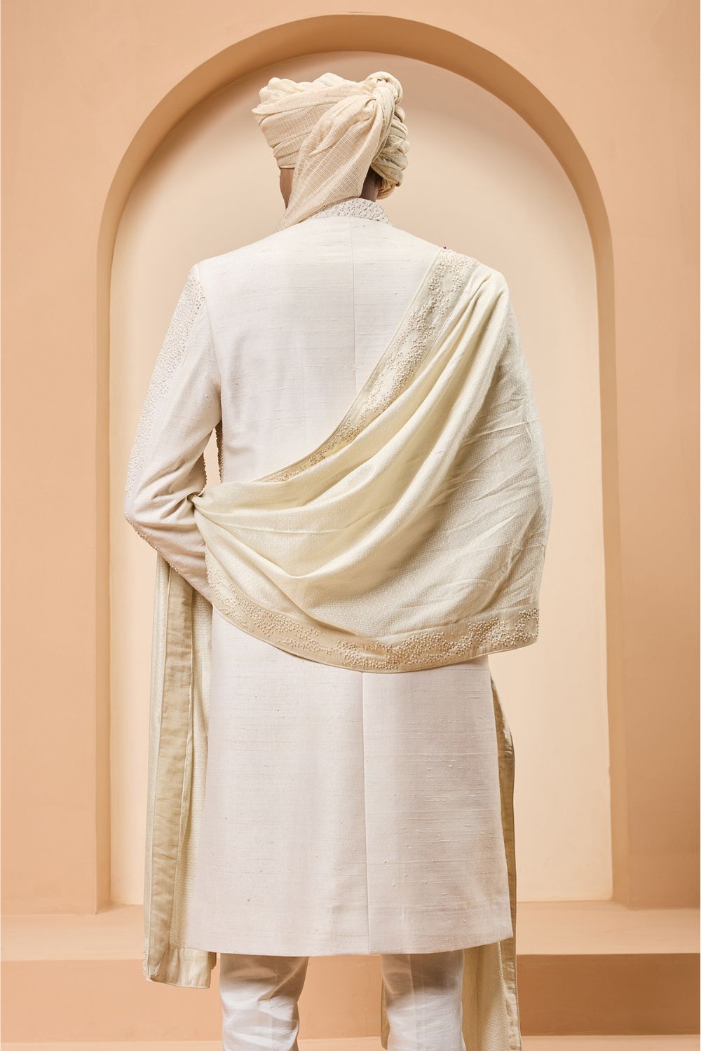 Ivory sherwani detailing with pearl,cutdana and thread work
