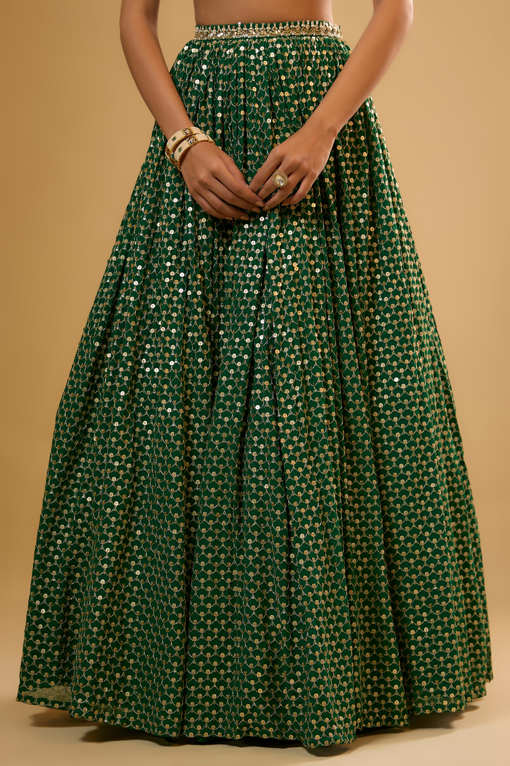 Emerald green georgette lehenga set embroidered with mirrors and gold sequins