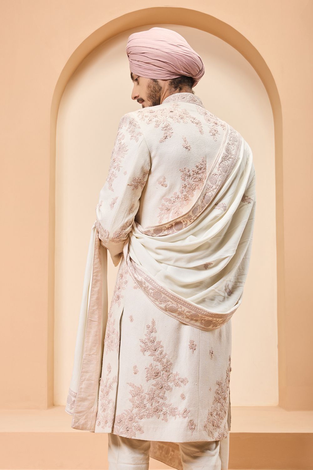 Ivory sherwani detailing with pearl,sequins and thread work