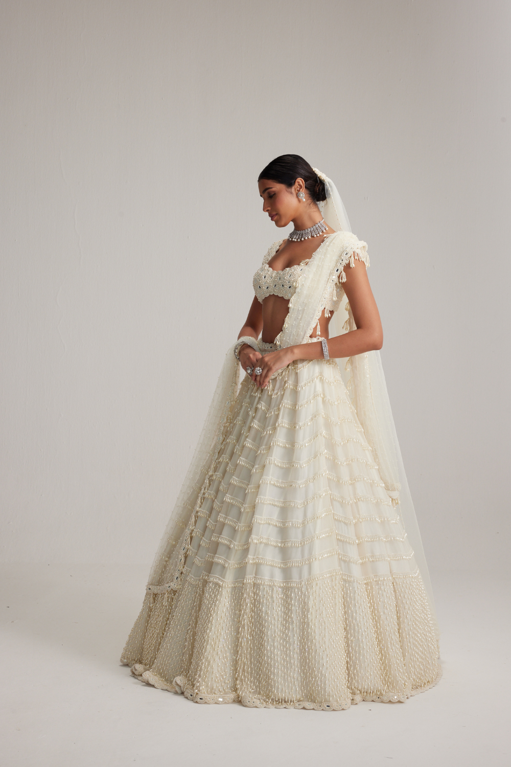 Off White Mirror and Pearl Drop Bridal lehenga set with Veil