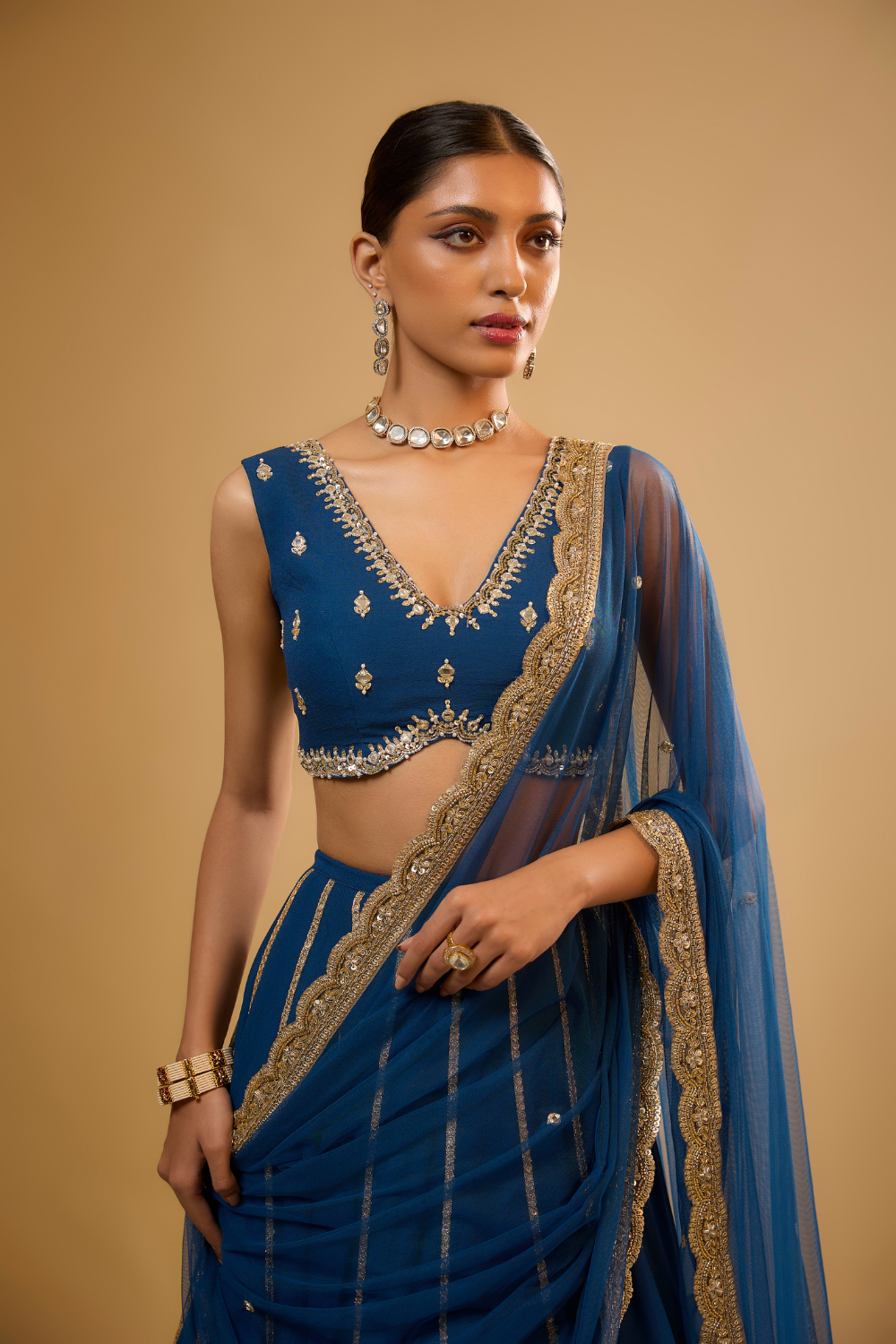 Egyptian blue georgette lehenga set embroidered with mirrors and gold sequins