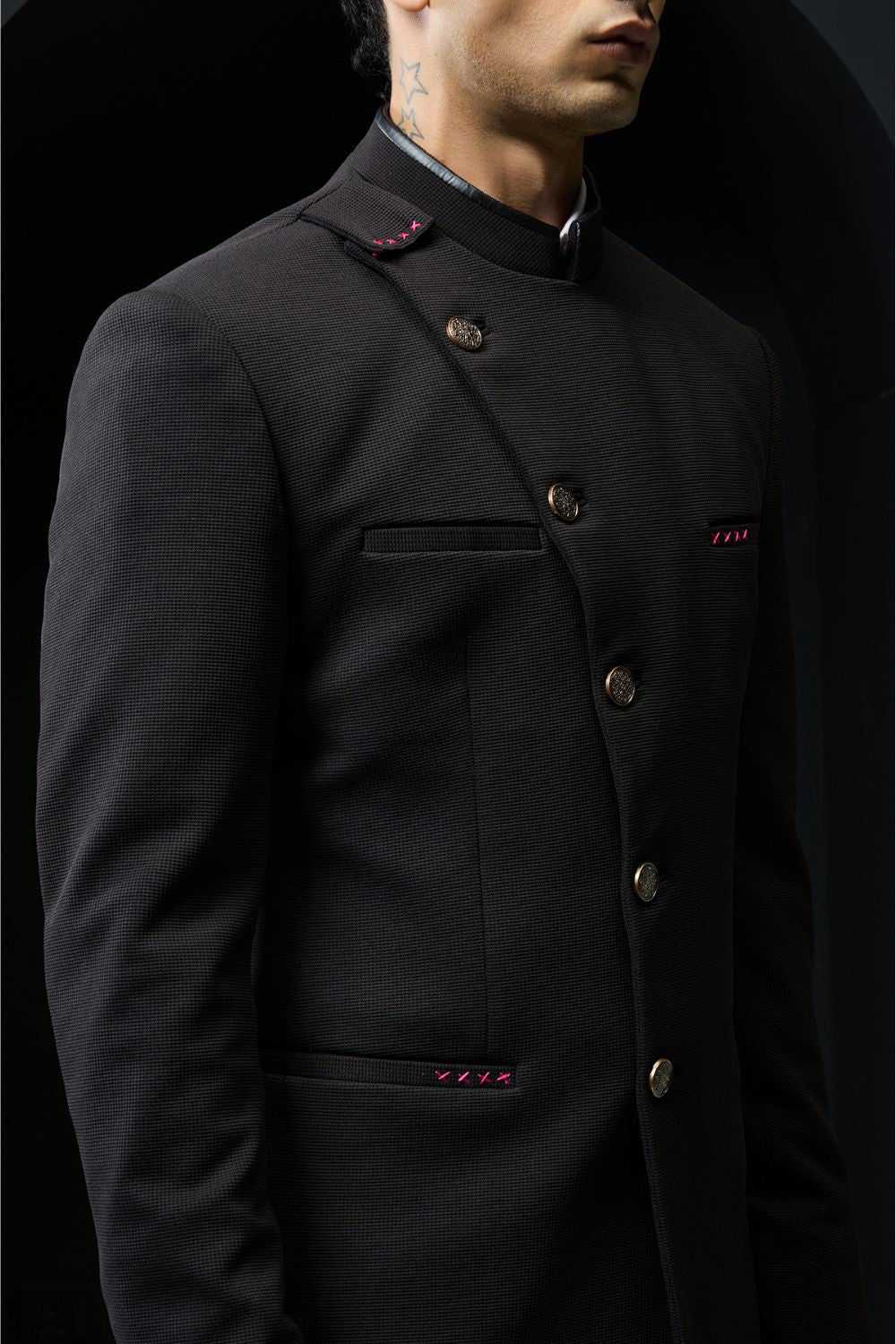 Black bandhgala with slant cut detailing with golden button and with satin taping