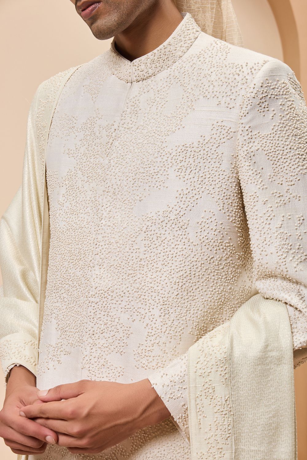 Ivory sherwani detailing with pearl,cutdana and thread work