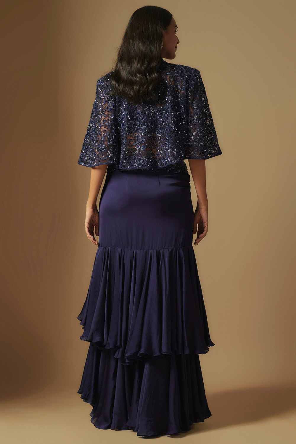 Marasu Mirror work blouse paired with hand embroidered cape and ruffled skirt