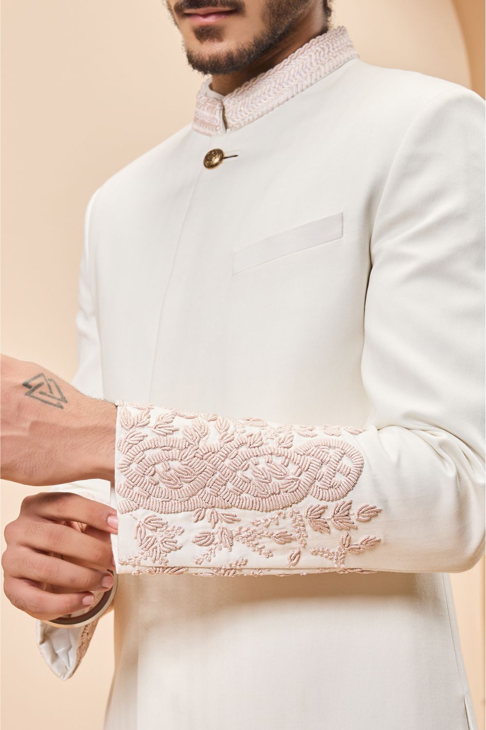 Ivory sherwani detailing with sequins and with thread work