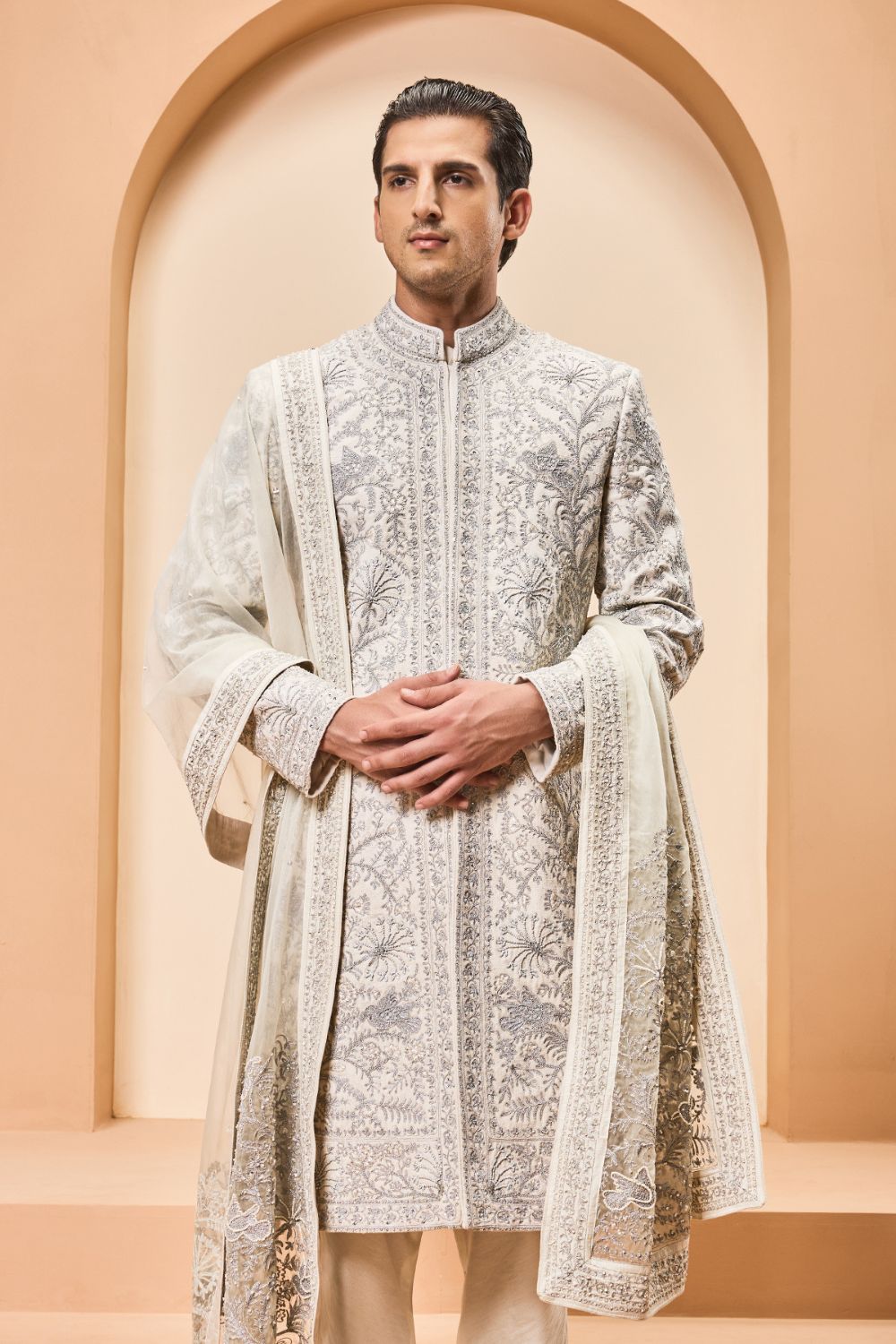 Ivory sherwani detailing with silver zari,pearl,sequins and thread work