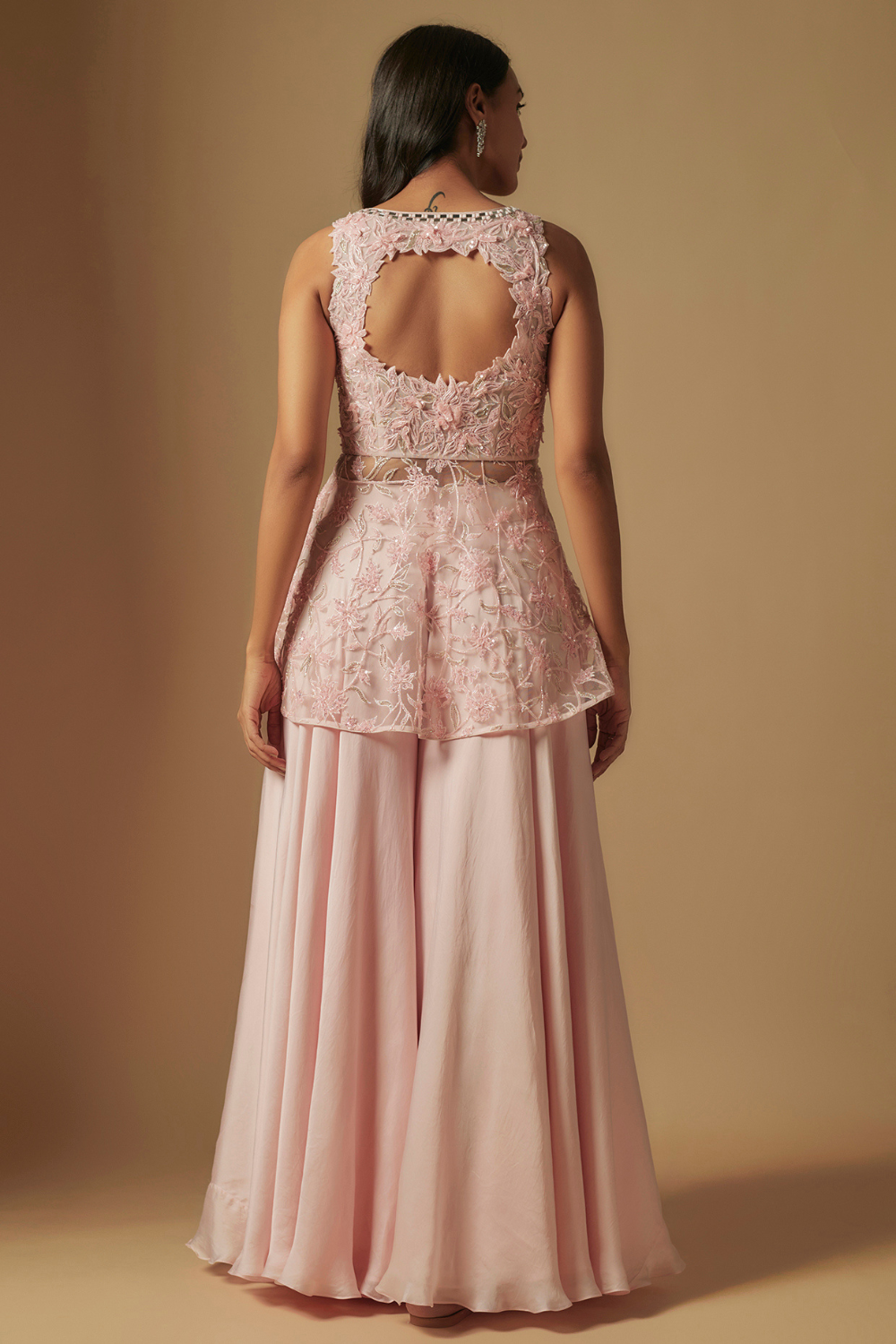 Noom Hand embroidered short kurti paired with sharara and dupatta