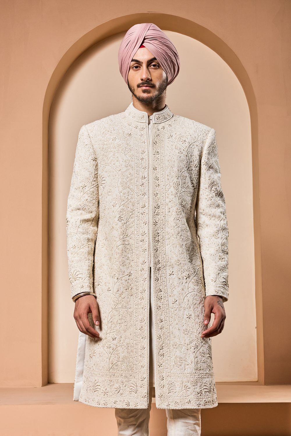 Ivory sherwani detailing with pearl,sequins and thread work