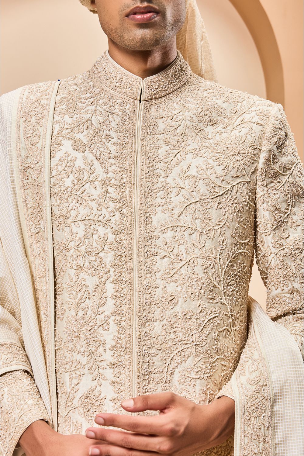 Ivory sherwani detailing with gold zari ,pearl,sequins and spring work