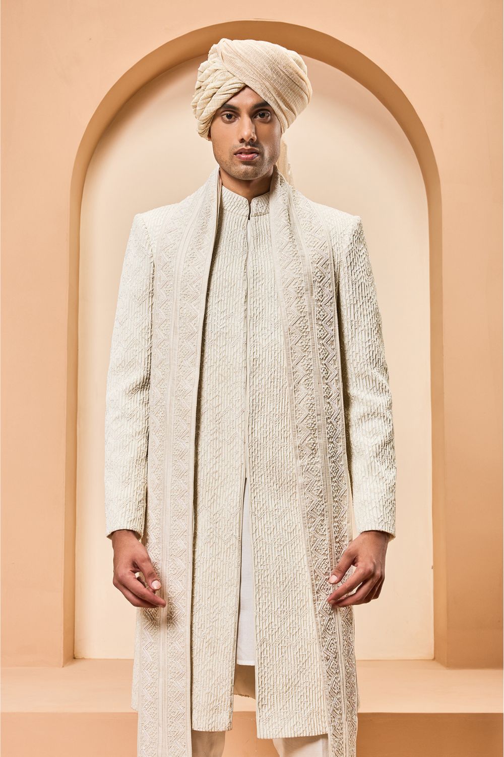Ivory sherwani detailing with pearl,cutdana and pintex work