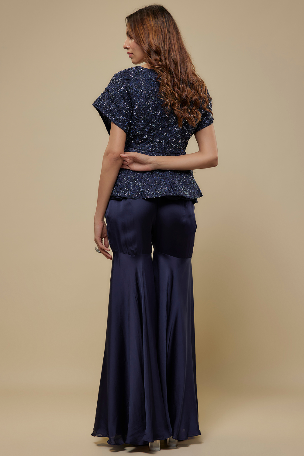Punzel navy blue full embroidered peplum top paired with satin organza sharara