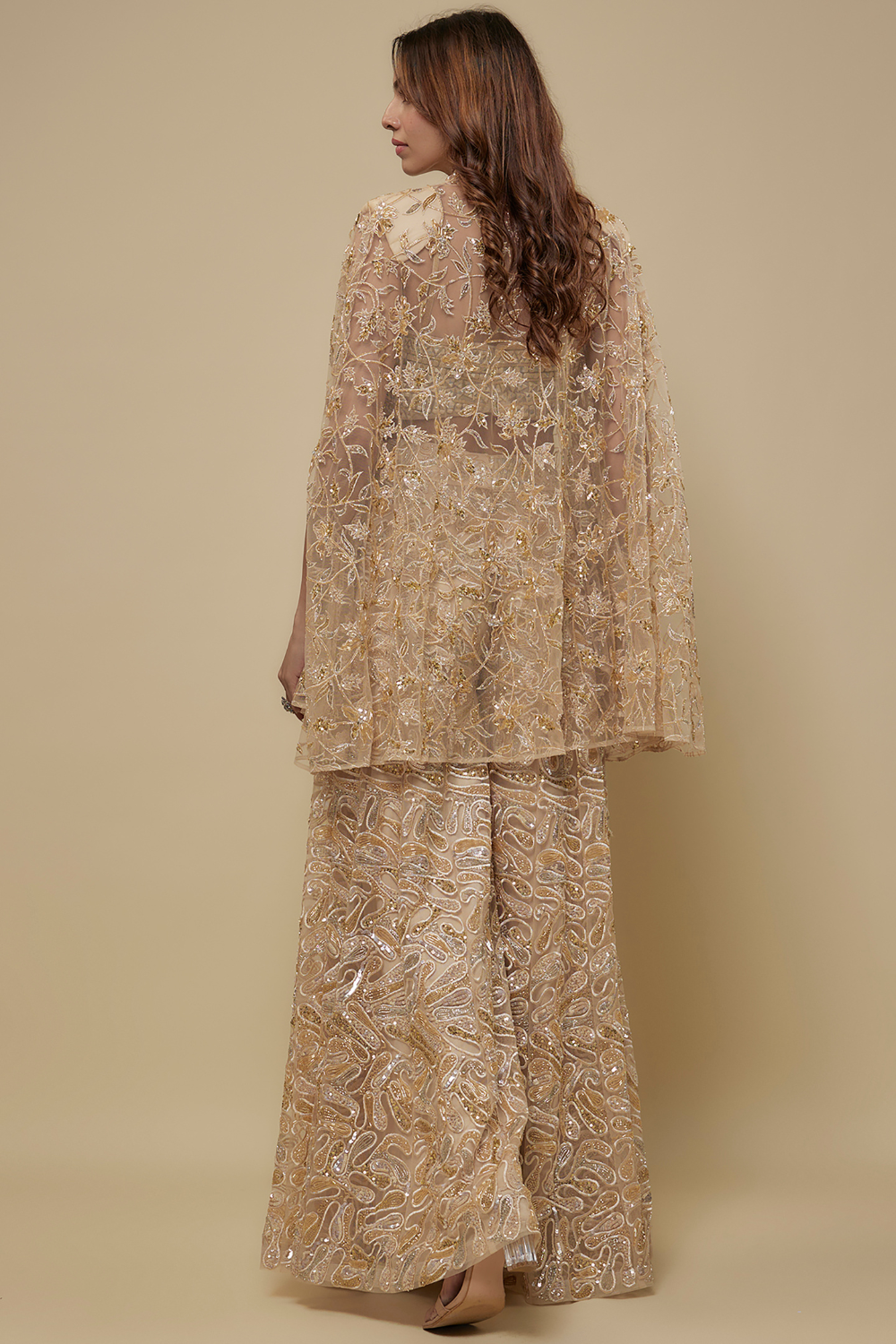 Couture -Full embroidered sharara paired with mirror work blouse and and embroidered cape