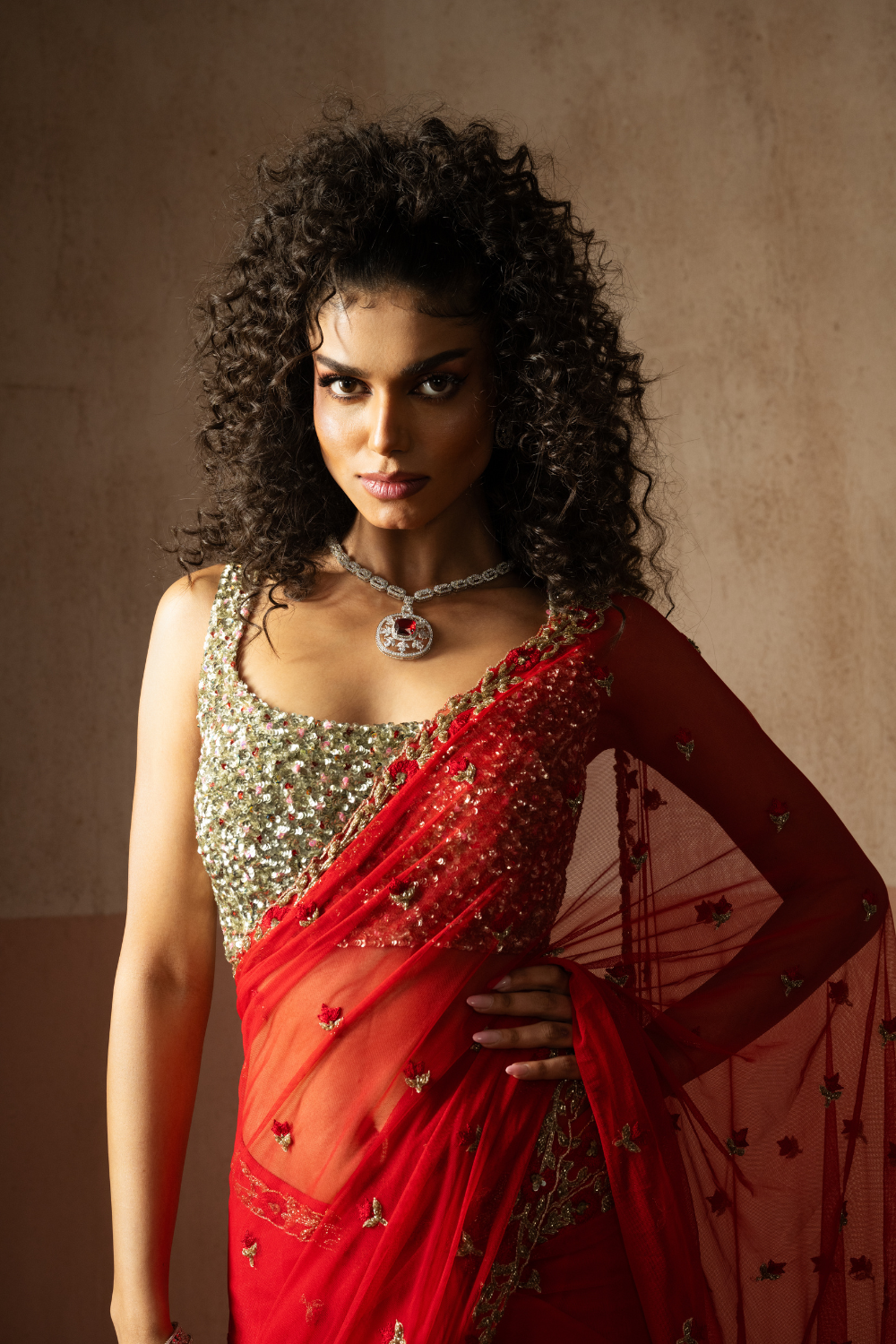 Predraped , red , hand embroidered net & georgette saree with golden blouse