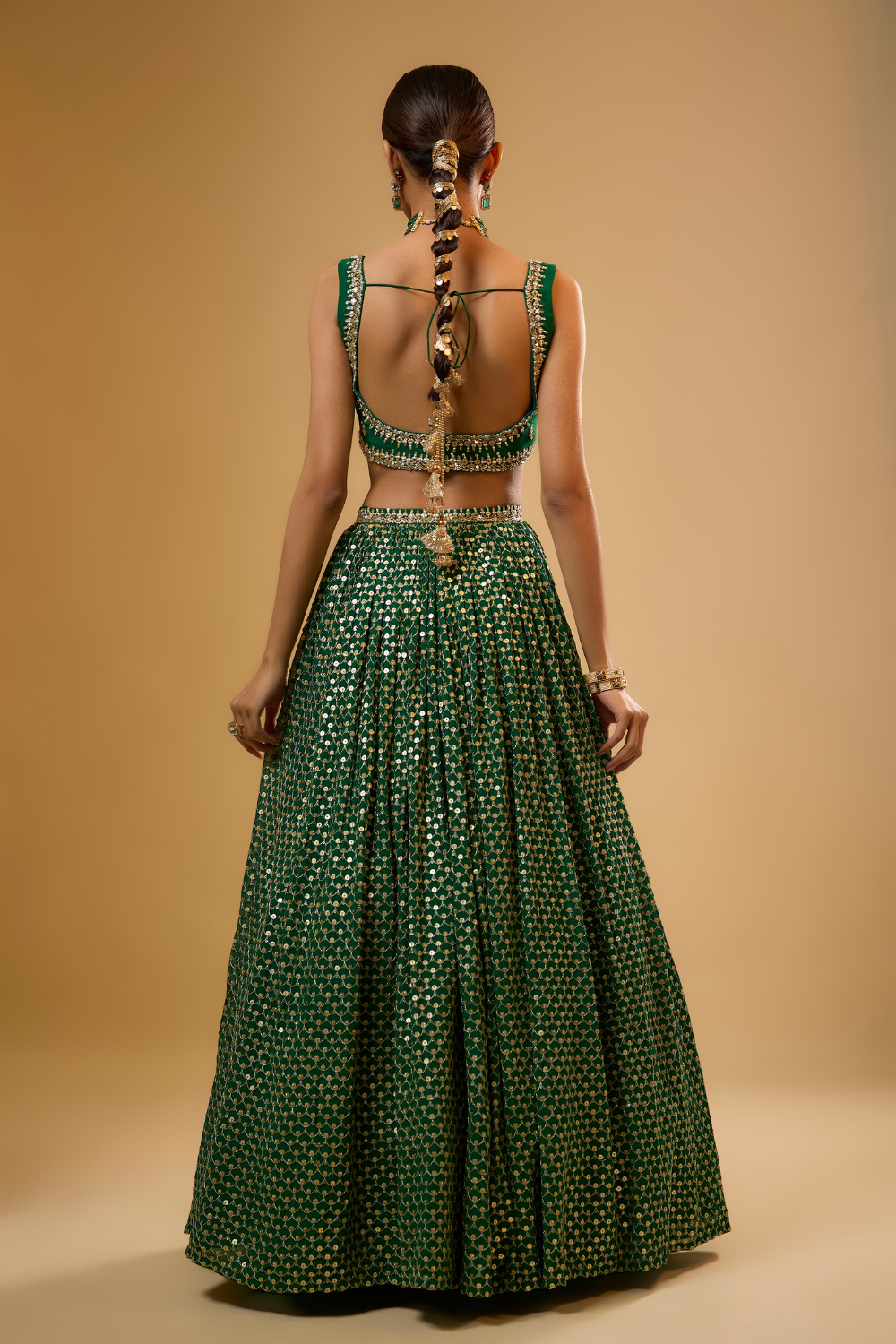Emerald green georgette lehenga set embroidered with mirrors and gold sequins
