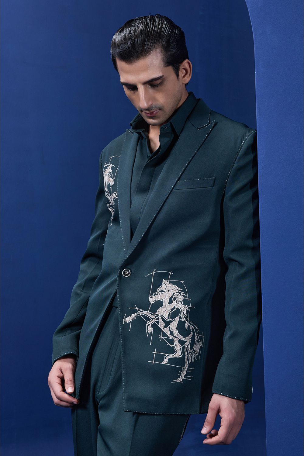 Green blazer detailing with thread work and horse embroidery