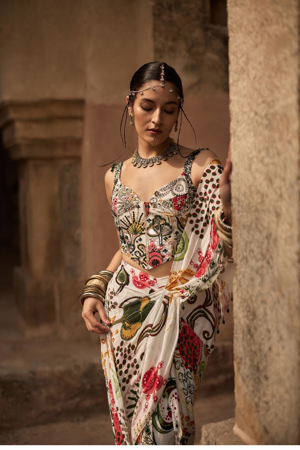 IVORY PRINT AND HIGHLIGHTED CORSET WITH DHOTI SKIRT SAREE SET
