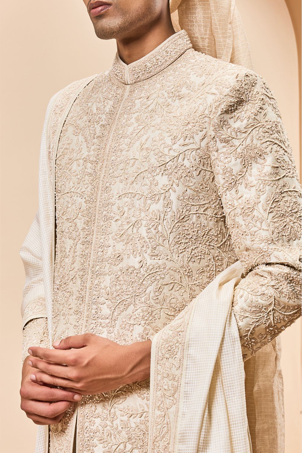 Ivory sherwani detailing with gold zari ,pearl,sequins and spring work