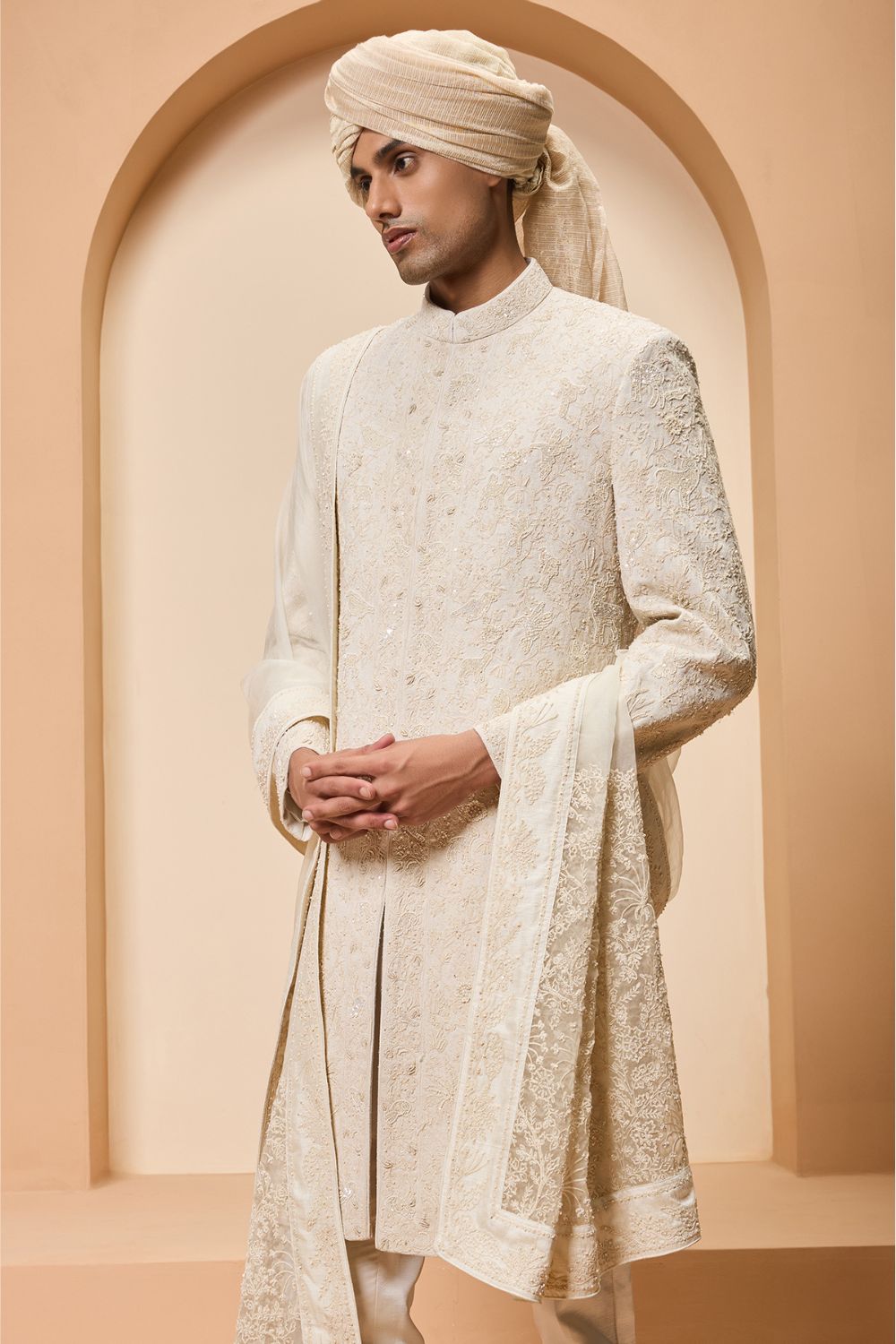 Ivory sherwani detailing with pearl,sequins and thread work