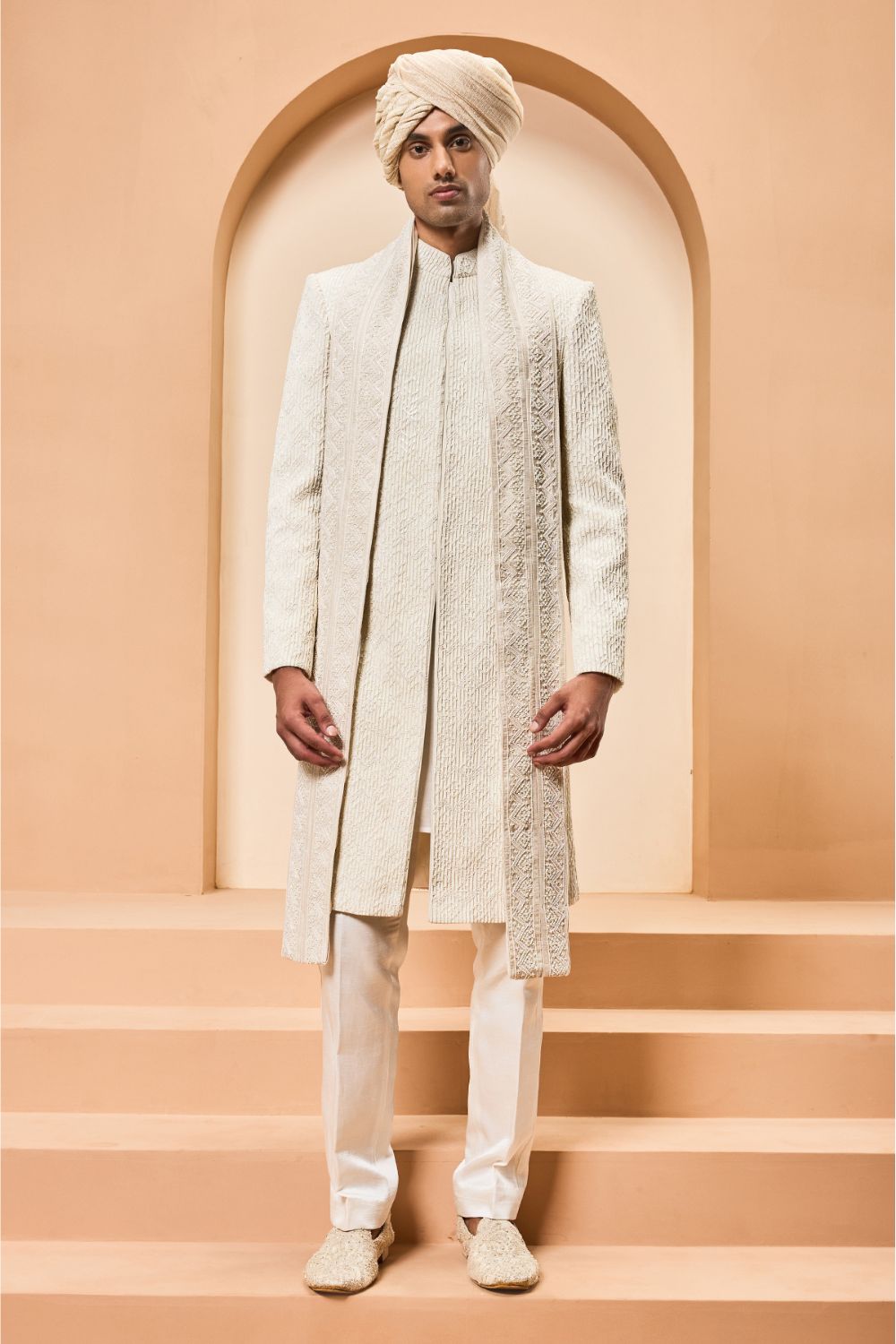 Ivory sherwani detailing with pearl,cutdana and pintex work