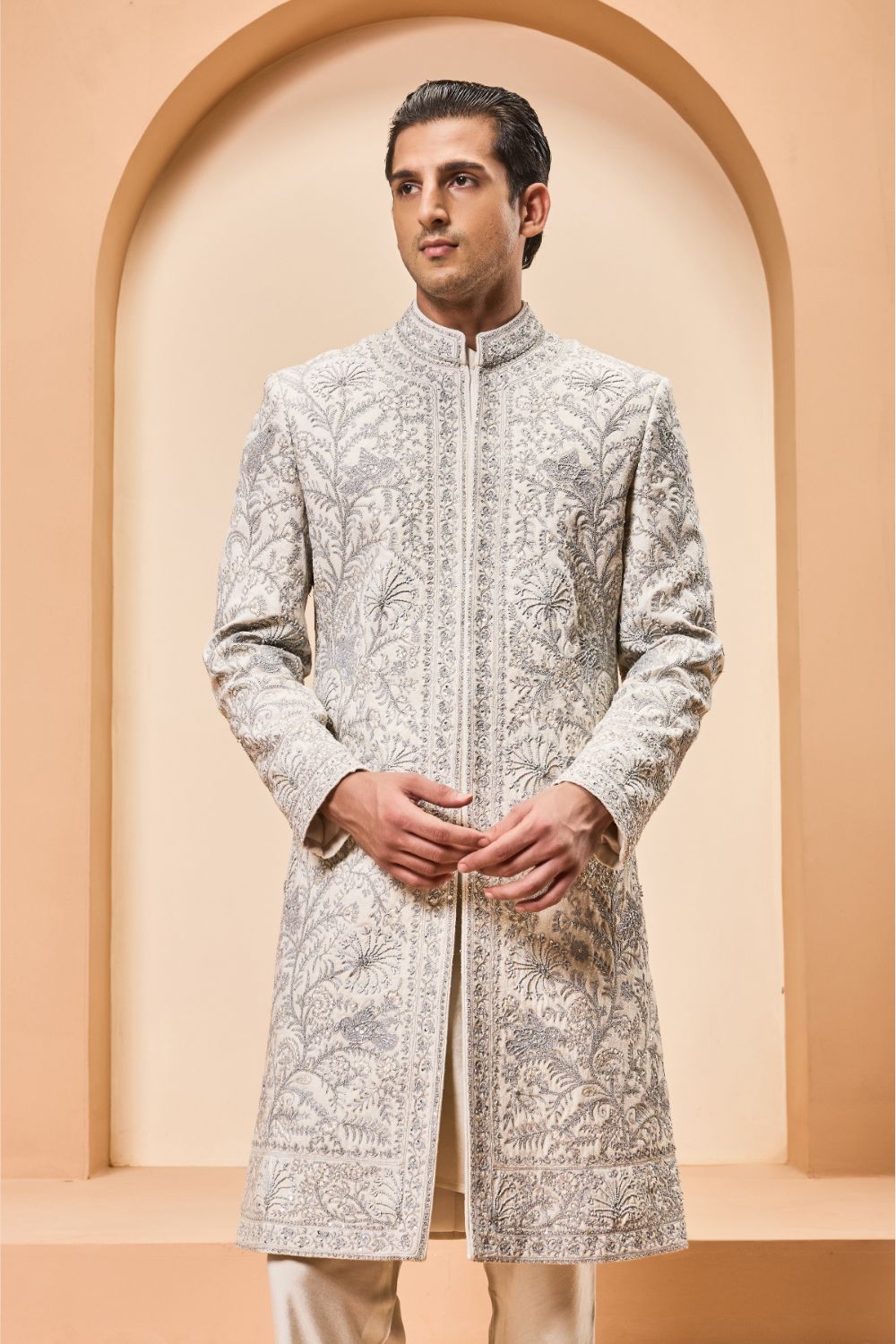 Ivory sherwani detailing with silver zari,pearl,sequins and thread work