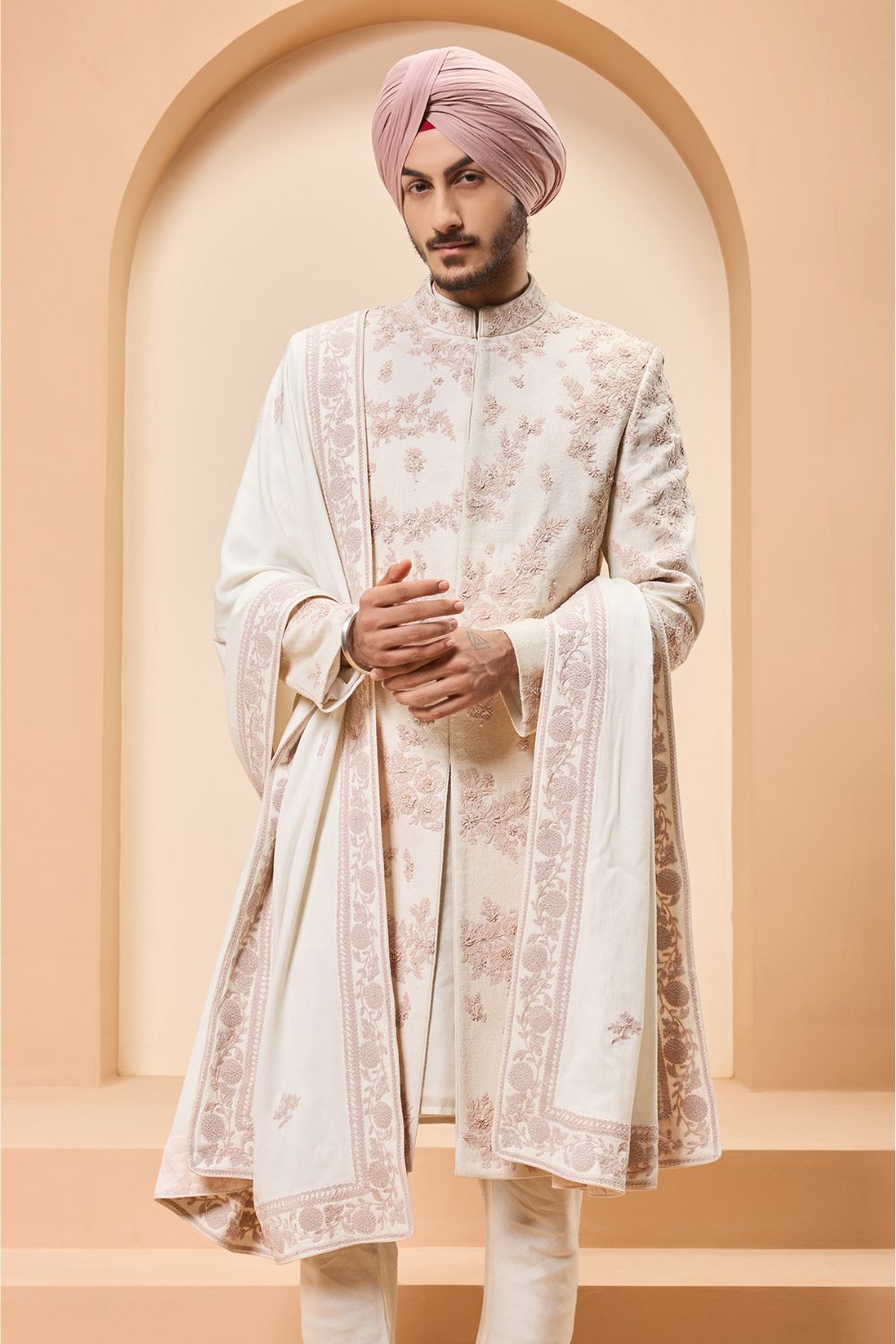Ivory sherwani detailing with pearl,sequins and thread work