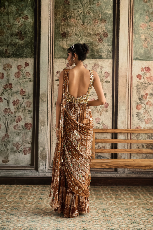 IVORY BUTTA PRINT AND HIGHLIGHTED SQUARE NECK BLOUSE WITH CARAMEL PRINT AND HIGHLIGHTED TIERED SKIRT SAREE SET