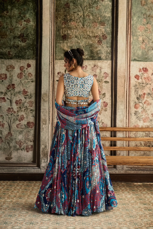 IVORY BUTTA PRINT AND HIGHLIGHTED BLOUSE WITH TEAL PRINT AND HIGHLIGHTED LEHENGA SET