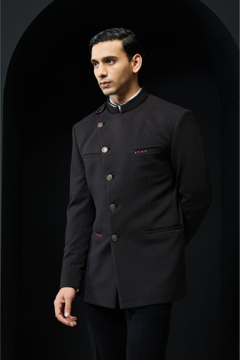 Black bandhgala with slant cut detailing with golden button and with satin taping