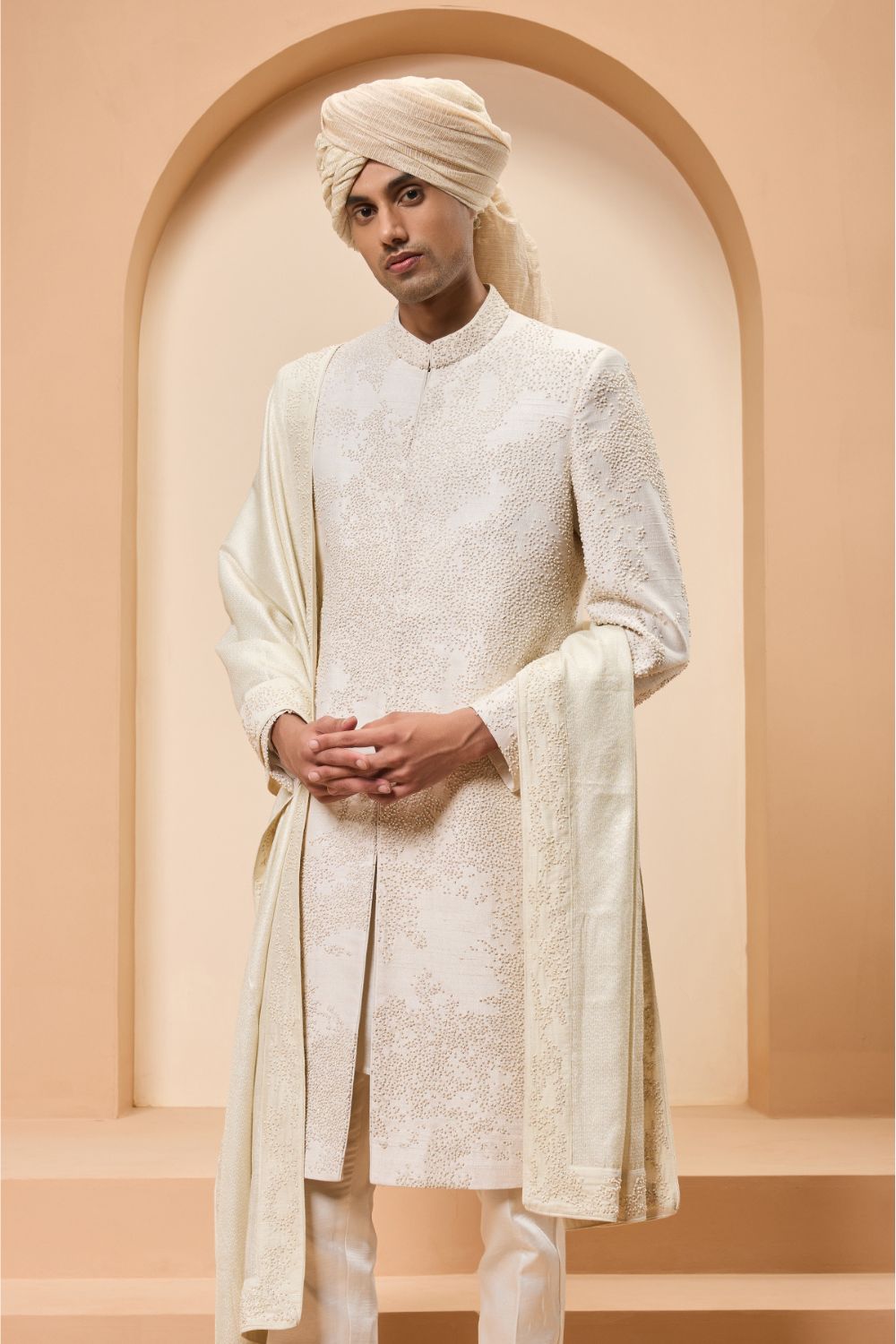 Ivory sherwani detailing with pearl,cutdana and thread work