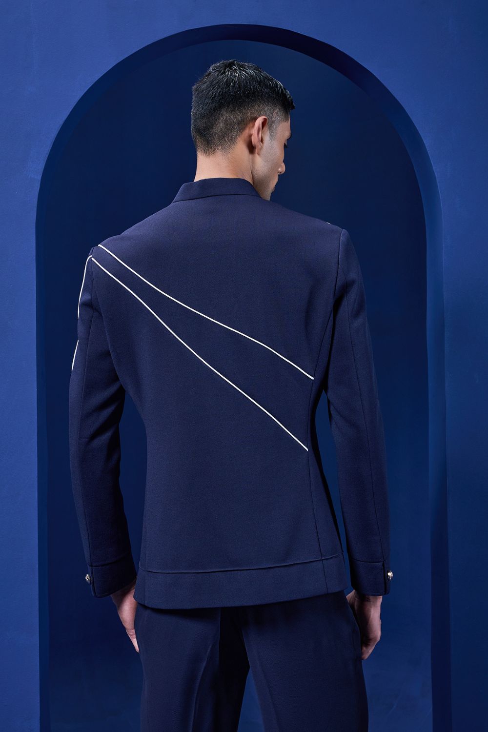 Navy blue jacket detailing with appliqué work and zipper