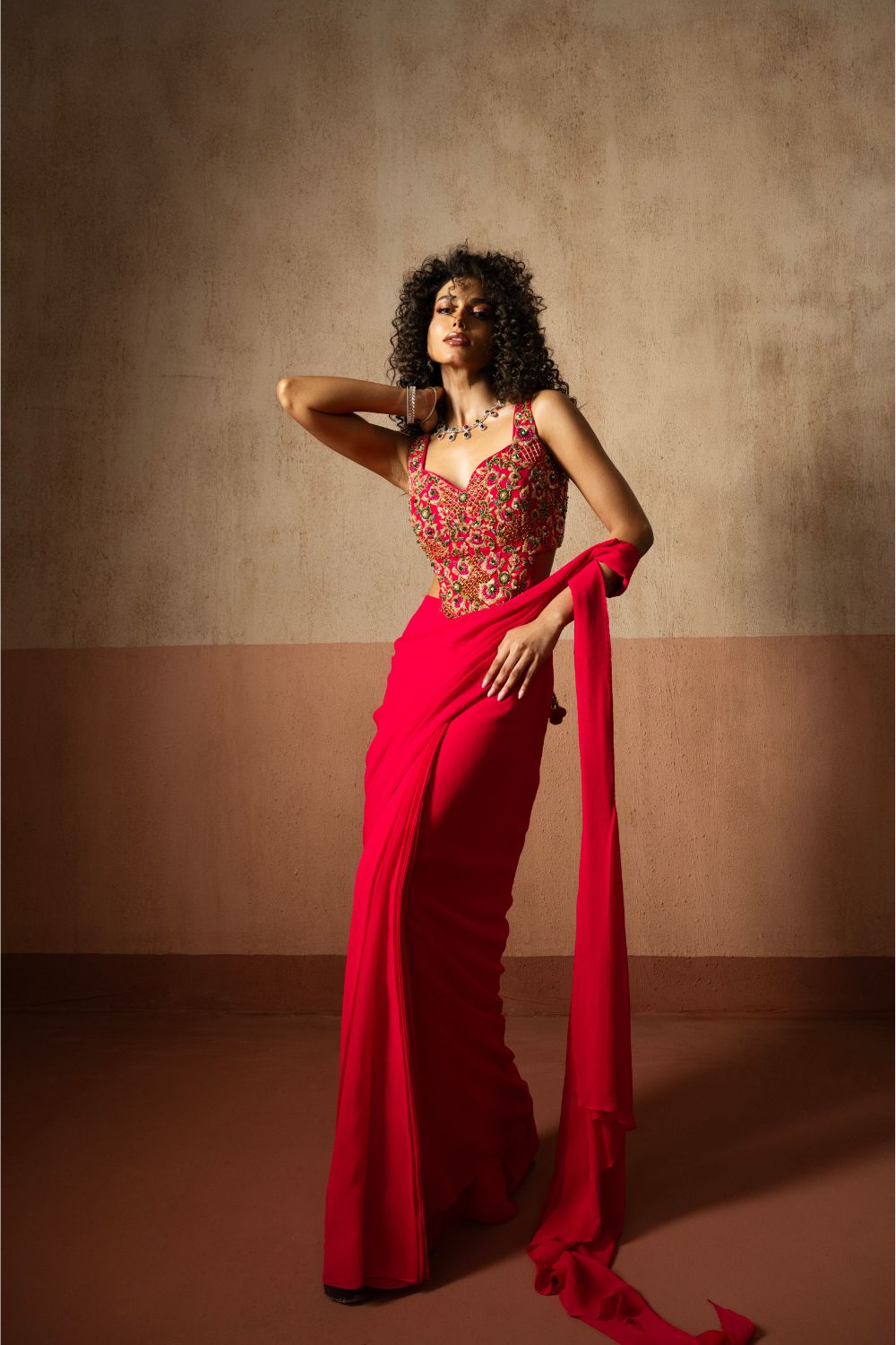Predraped , fuschia pink , embroidered georgette saree with corset blouse