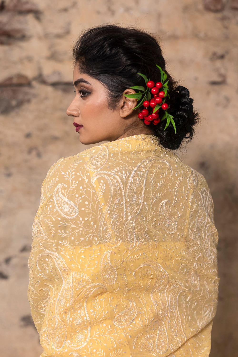 Yellow Pleated Sharara Paied With Peplum Top And Embroidered Dupatta